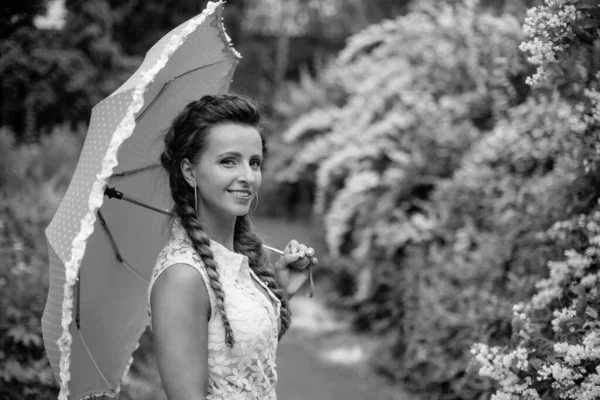 Umbrella. Young woman with an umbrella from the rain.