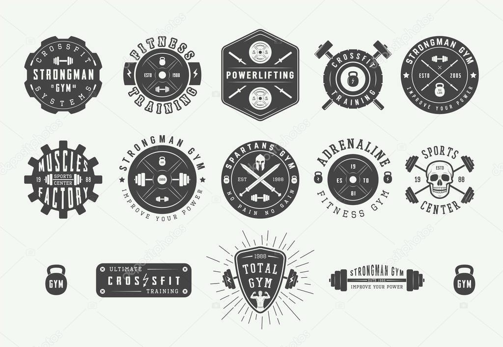 Set of vintage gym fitness logos, emblems, badges, labels, marks and design elements. Retro graphic art. Vector Illustration.