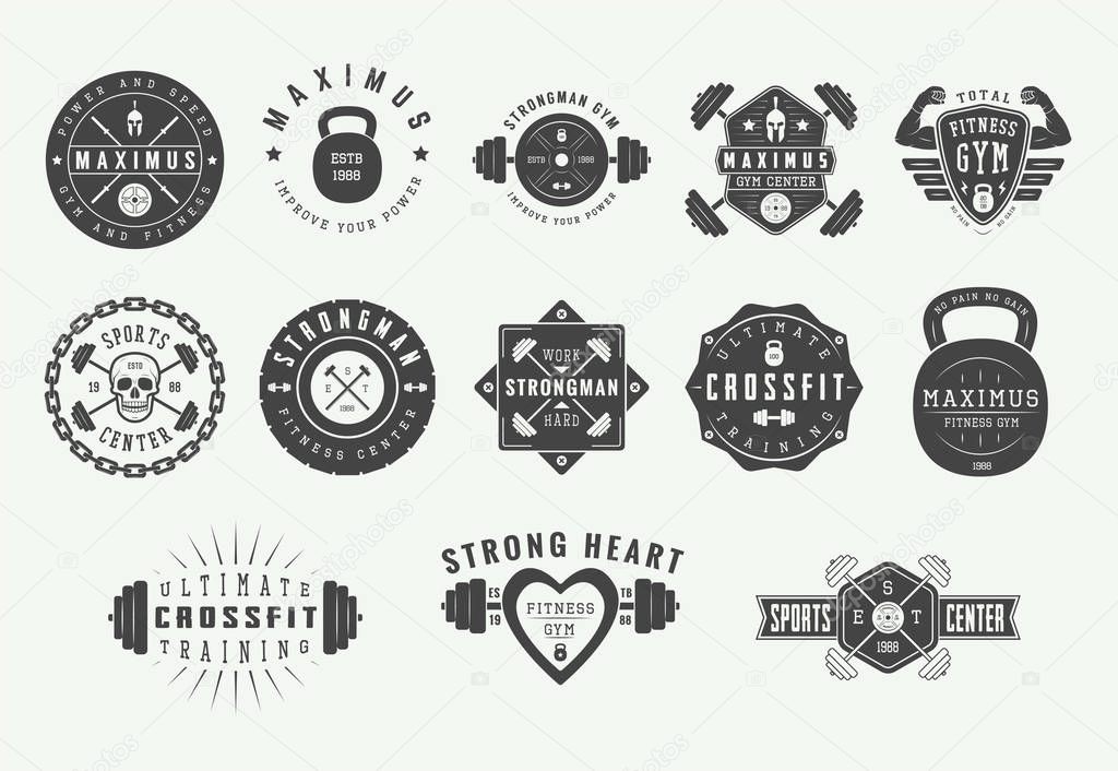Set of vintage gym fitness logos, emblems, badges, labels, marks and design elements. Retro graphic art. Vector Illustration.