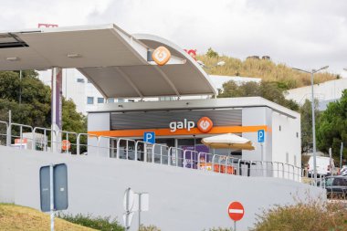 Galp gas station with its logo and canopy visible on a cloudy day