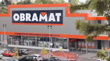 Obramat hardware store in portugal, showing the storefront, parking lot, and surrounding area