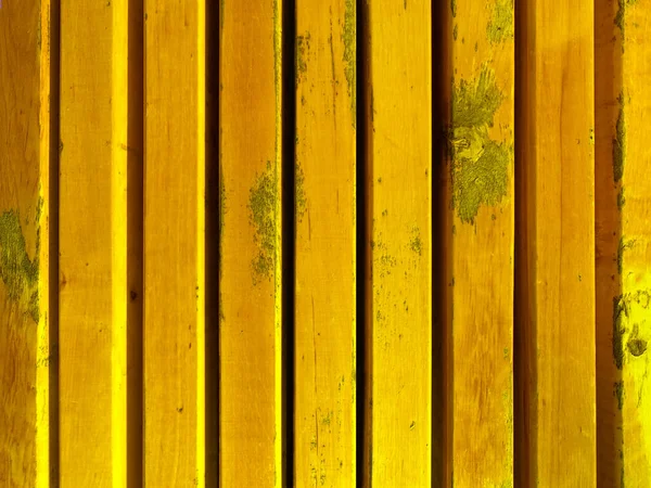 Wooden rough bars of yellow color
