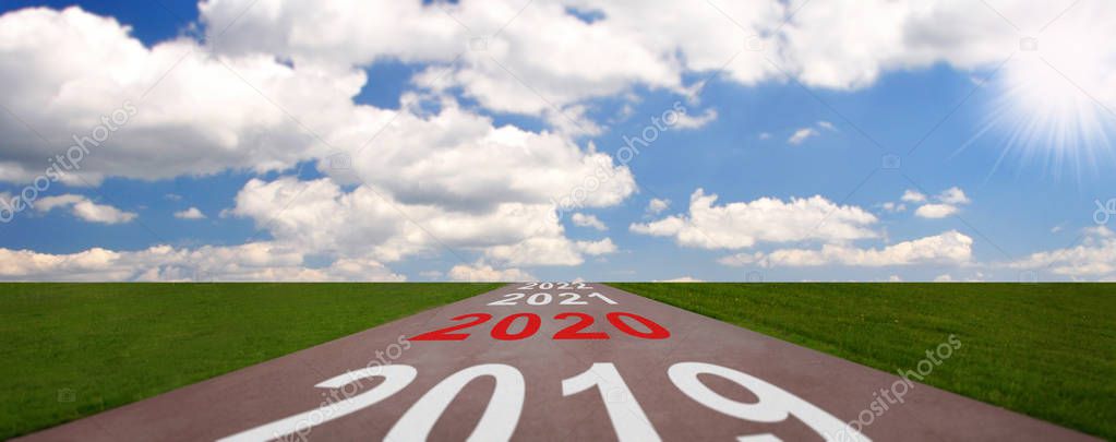 Desert road with the inscription 2018 2019. Concept of the departing old year and new goals