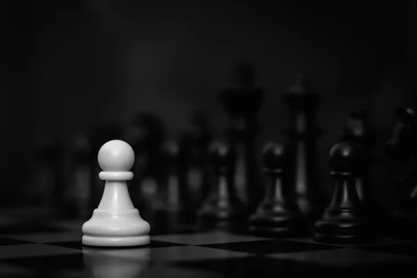 Selected focused chess set. White go the first. The central figure-pawn is on focused. Teamwork concept. — Stock Photo, Image