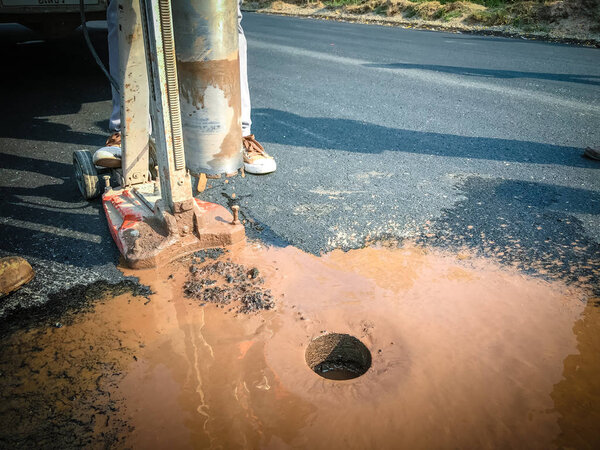 Inspection of asphalt road.