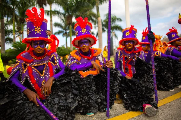 stock image Dominican Republic, Punta Cana - March 3, 2018: People in colorful themed costumes at a Carnival. Faces painted with national colors. men in strange costumes