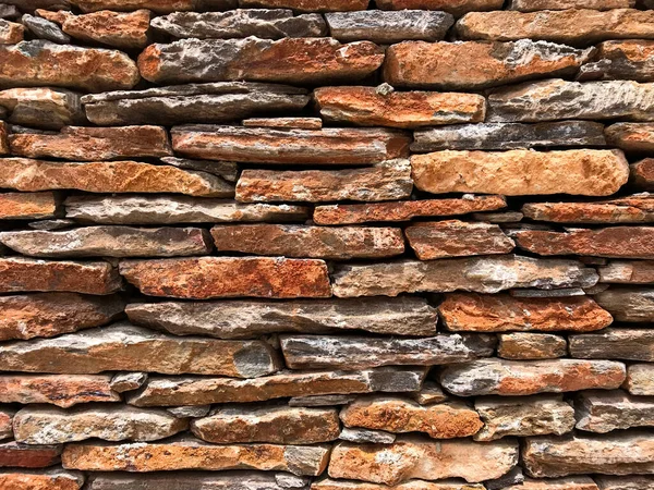 Close up of brick wall faced with fine slate stone. Copy space text design background