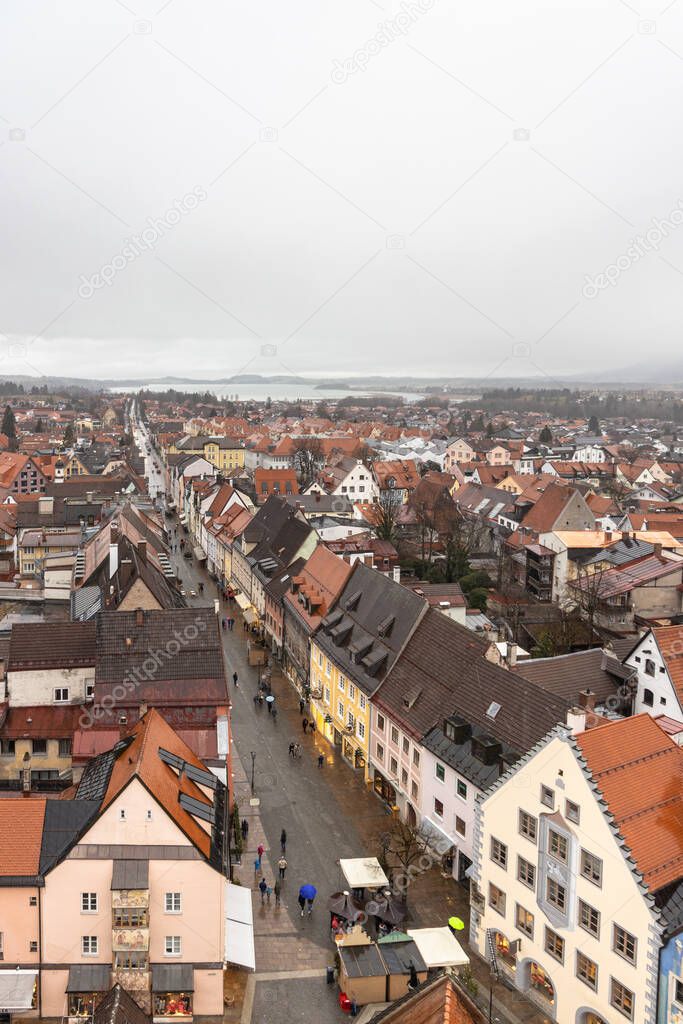 Aerial view of the old town of Fussen on a cloudy winter day from the Hohes Schloss castle, with the Forggensee lake in background, Allgaeu, Bavaria, Germany