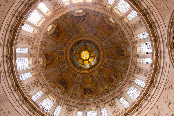 Berlin, Germany - April 20, 2019 - Stunning interior view of the roof of Berlin Cathedral with beautiful painting and relief sculpture, Berlin, Germany