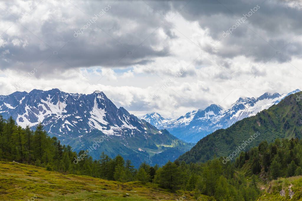 Panorama view of the mountain range of swiss Alps in Canton Tessin (Ticino),  beyond the Ritom lake, Switzerland.