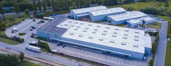Aerial view of warehouse storages or industrial factory or logistics center from above. Aerial view of industrial buildings and equipment machines