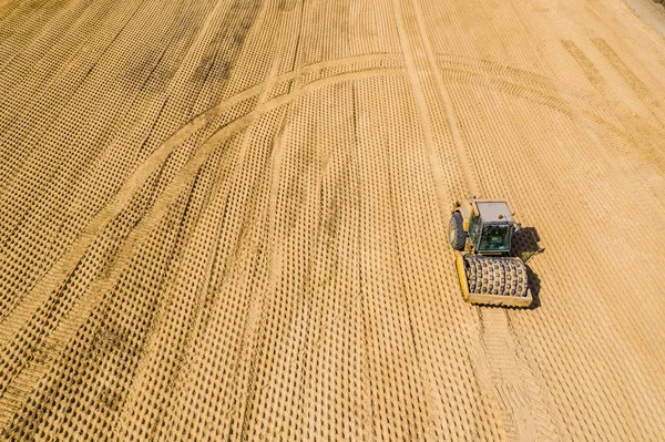 Rodillos de carretera que trabajan en la vista aérea del sitio de construcción —  Fotos de Stock