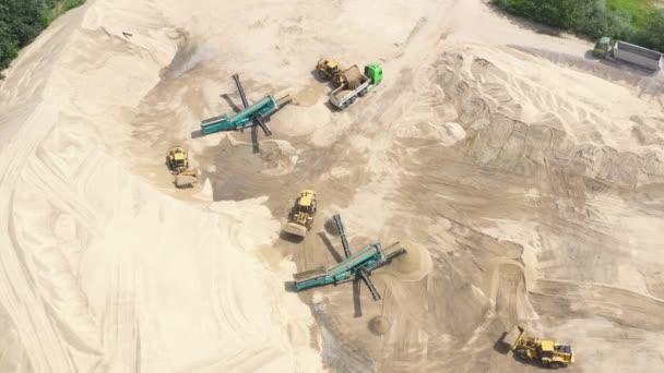 Aerial view loading bulldozer in open air quarry. Sand loading — Stock Video