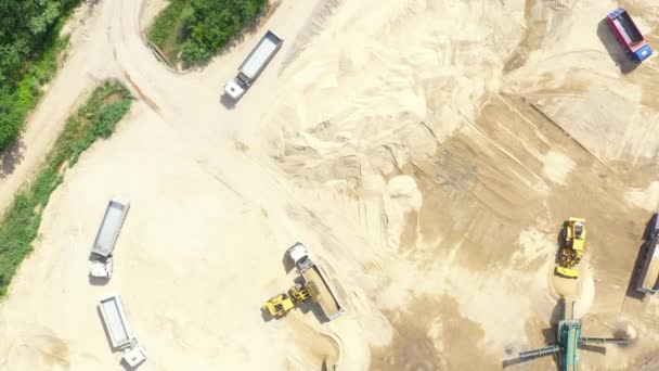 Aerial view loading bulldozer in open air quarry — Stock Video