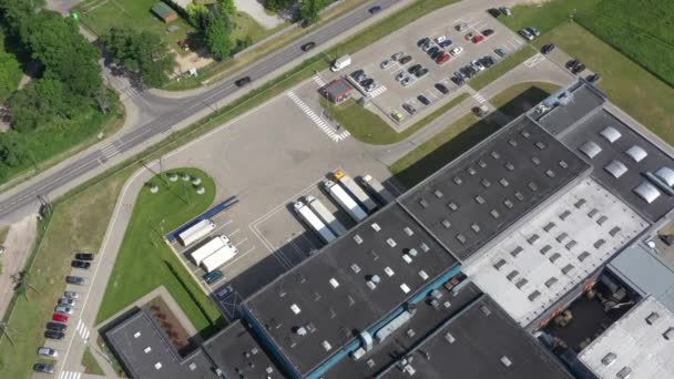 Aerial view of the logistics warehouse with trucks waiting for loading — Stock Video