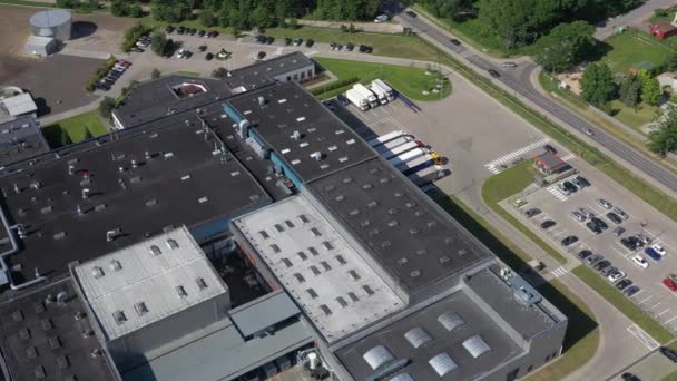 Aerial Shot of Truck with Attached Semi Trailer Leaving Warehouse complex — Stock Video