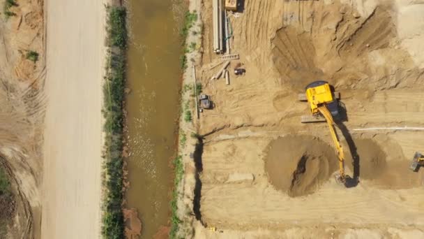 Heavy machinery works of a motorway - Highway Construction. Aerial View — Stock Footage Heavy machinery works of a motorway - Highway Construction. Aerial View Stock Footage