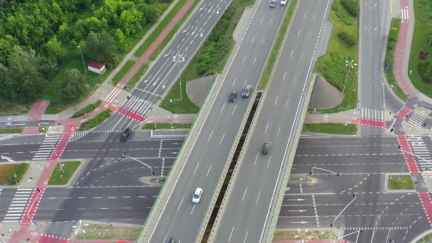 Aerial top down view of interchange road junction traffic. Drone shot flying — Stock Video