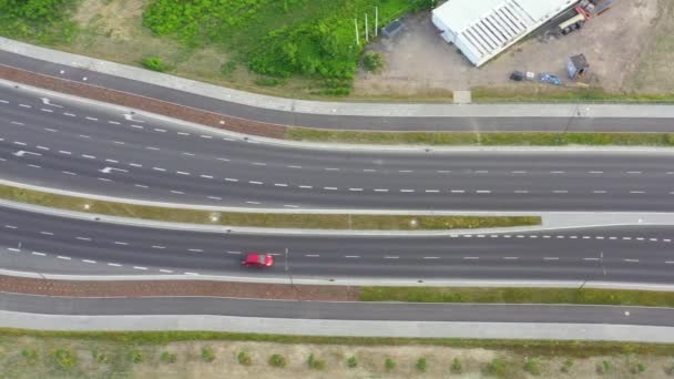 Aerial top down view of interchange road junction traffic. Drone shot flying — Stock Video