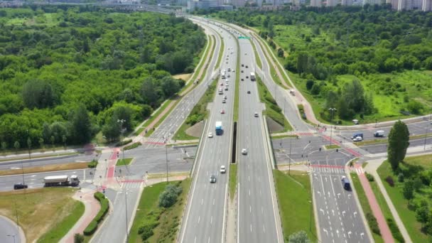 Top view of freay road. Clip. Highway with traffic in forest. Suburban highway with cars and trucks. Travel and transportation. Aerial view — Stock Video