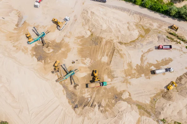 Aerial view over the building materials processing factory. Sand