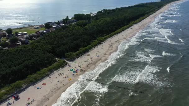 Beach in Chalupy resort in Poland. Aerial video. Baltic Sea. People on towels. — Stock Video