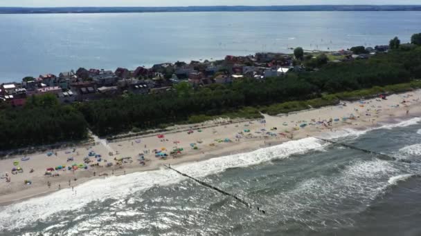 stock video Beach Chalupy resort in Poland. Aerial video. Baltic Sea. People on towels. Waves