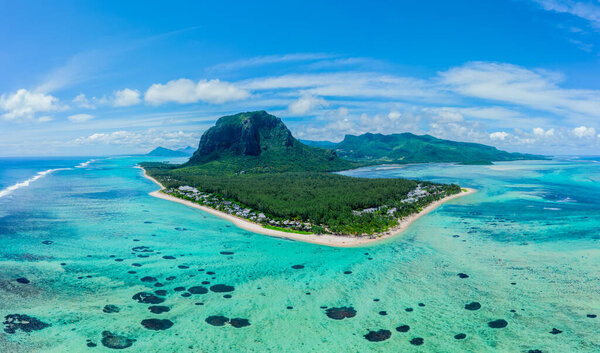Aerial view of Le Morne Brabant, a UNESCO world heritage site.Coral reef of the island of Mauritius. panorama underwater waterfall