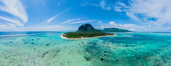 Aerial view of Le Morne Brabant, a UNESCO world heritage site.Coral reef of the island of Mauritius. panorama underwater waterfall