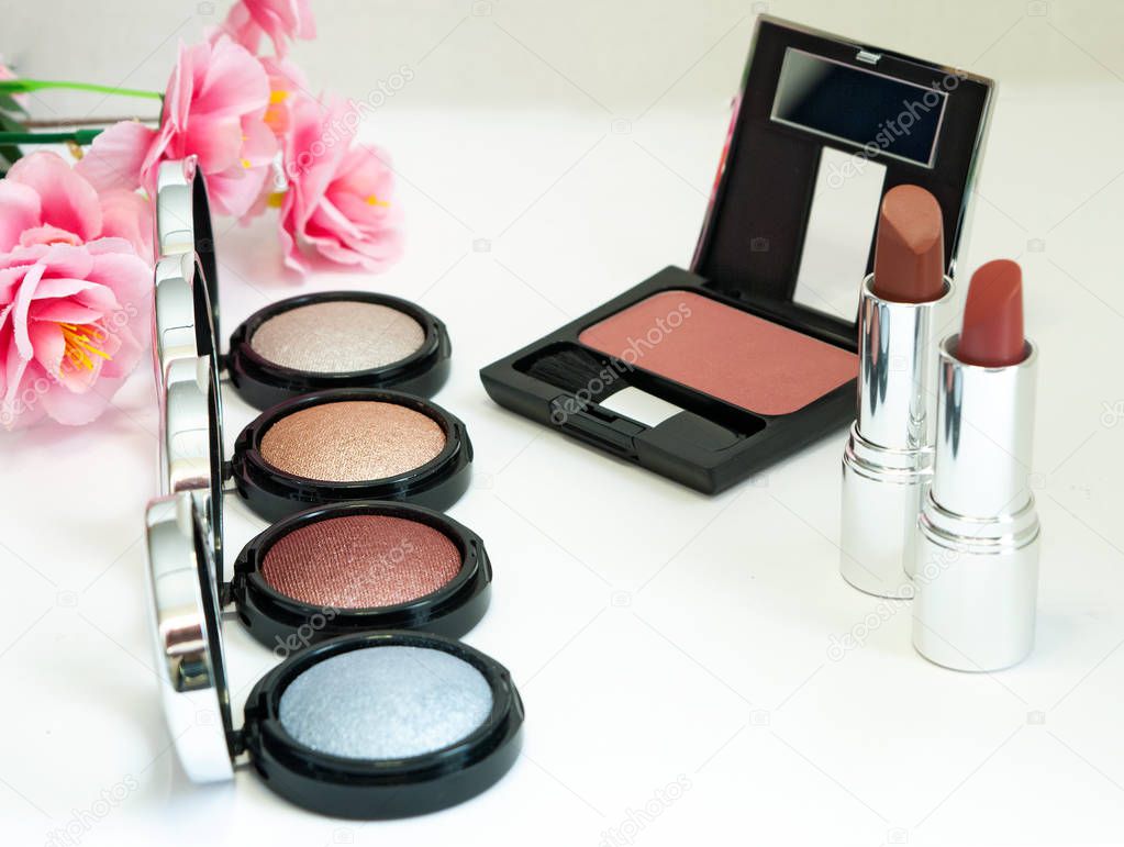 Makeup products with flower background