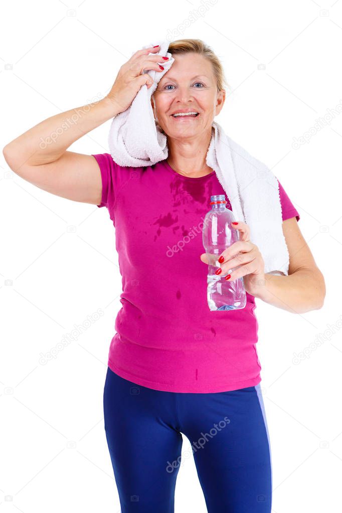 Happy and smile old senior woman in sport outfit marsala color with white towel on her neck, hold water bottle in hand and mop one's brow after fitness exercises, isolated on white background