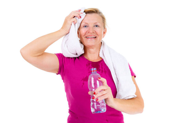 Smile Senior old woman with white teeth wiping off sweat off her forehead and holding a bottle of water in hand, isolated on white background, Positive human emotions