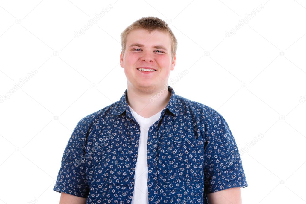 Closeup portrait of happy smiling young man 20-25 years in shirt looking at camera, isolated on white background. Positive human emotion