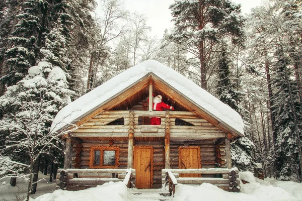 Home of Santa Claus at the North Pole. Real Santa Claus on the balcony in his house.