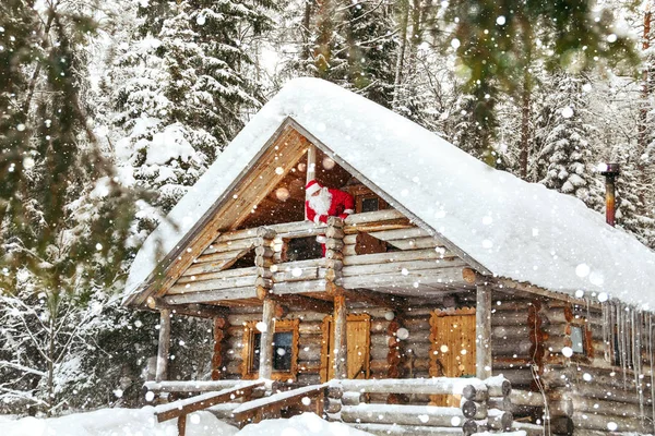 Home of Santa Claus at the North Pole. Real Santa Claus on the balcony in his house.