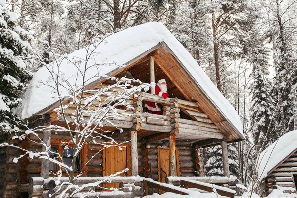 Home of Santa Claus at the North Pole. Real Santa Claus on the balcony in his house.