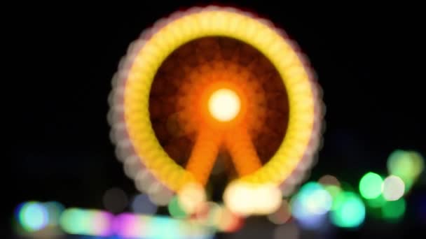 Τροχός Λούνα Παρκ Νύχτα Θολή Πολύχρωμα Φώτα Από Ένα Πάρκο — Αρχείο Βίντεο