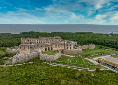 Aerial view of ruined Borgholm castle with round towers, star fort bastions on the the island of land in Sweden
