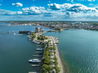 Vstervik: A breathtaking aerial view of the Swedish archipelago, city, and coastline, revealing a harbor, islands, and verdant land.