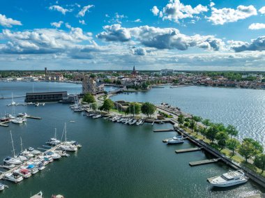 Vstervik: A breathtaking aerial view of the Swedish archipelago, city, and coastline, revealing a harbor, islands, and verdant land.
