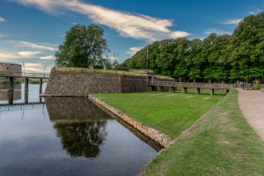 View of triangle shape ravelin protecting the gate of Kalmar castle wooden bridge over the moat in Sweden
