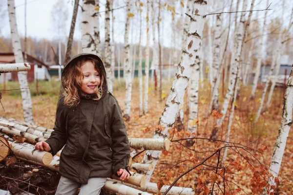 Happy Kid Girl Sitting Birch Wood Stack Autumn Forest — Stock Photo, Image