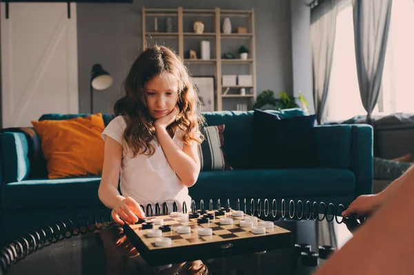 Lifestyle Shot Smart Kid Girl Playing Checkers Home Board Games — Stock Photo, Image