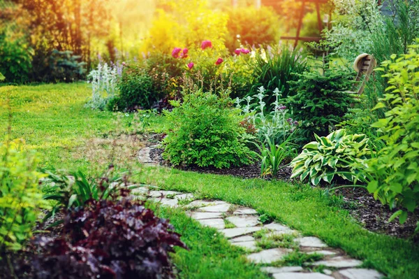 Beautiful summer cottage garden view with stone pathway and blooming perennials — Stock Image Beautiful Summer Cottage Garden View Stone Pathway Blooming Perennials Royalty Free Stock Photos