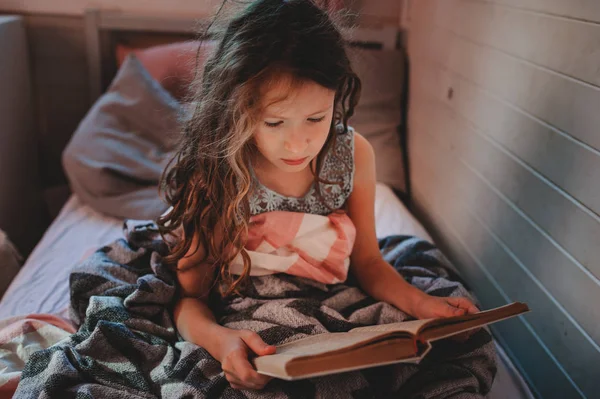 Thoughtful Kid Girl Reading Book Alone Her Room Veening Early — Stock Photo, Image