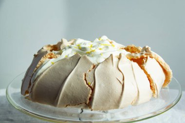 Homemade meringue cake Pavlova with whipped cream. Summer cake. Crusty dessert. close up view