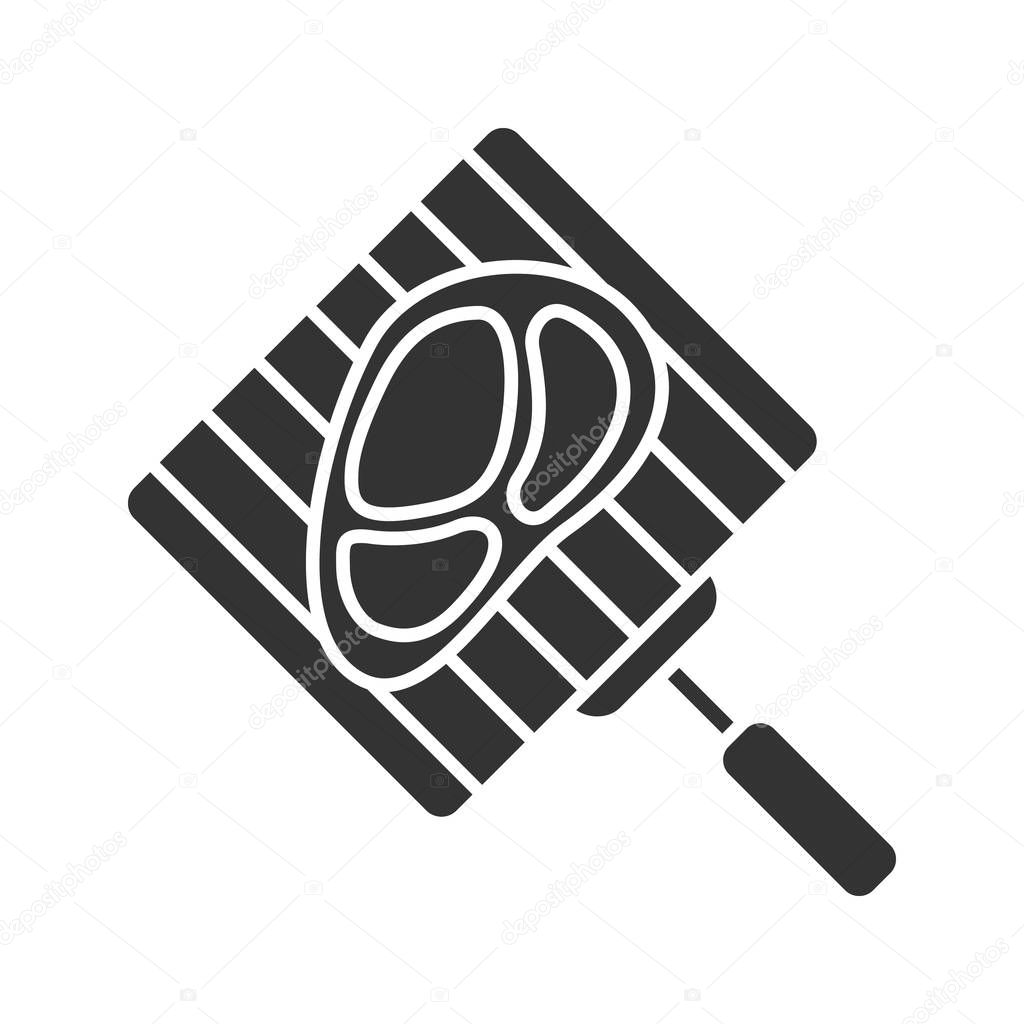 Hand grill with steak glyph icon. Barbecue grid with beefsteak. Silhouette symbol. Negative space. Vector isolated illustration