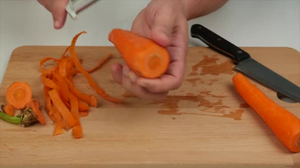 Man Peeling Carrots Peeler Healthy Diet Food — Stock Video