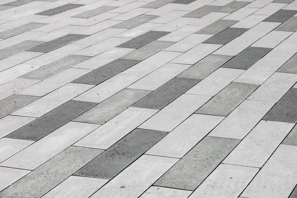 Gray concrete tiles in perspective