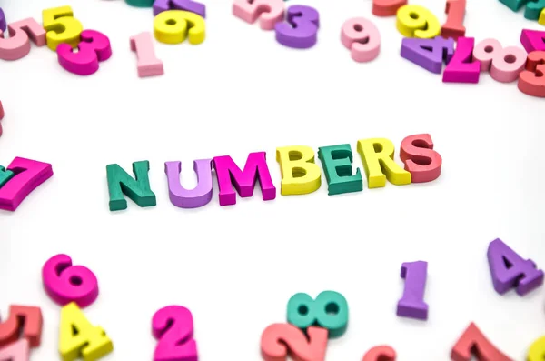 Word Numbers Laid Out Wooden Multicolored Letters Surrounded Scattered Colored — Stock Photo, Image